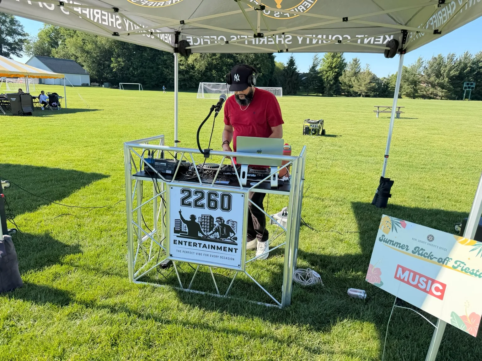 DJ facing a crowd at a large event