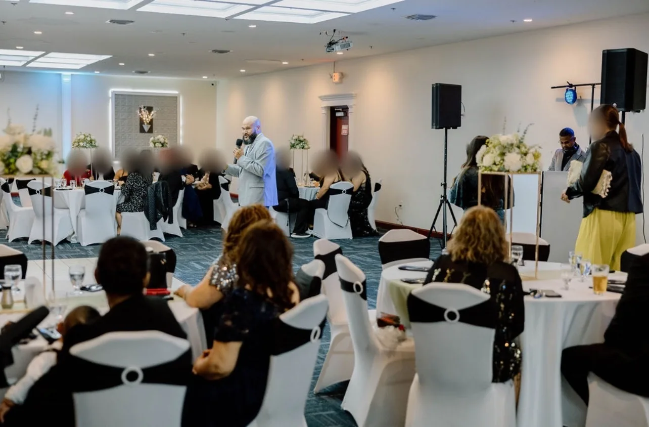 MC with guests dancing at a private celebration