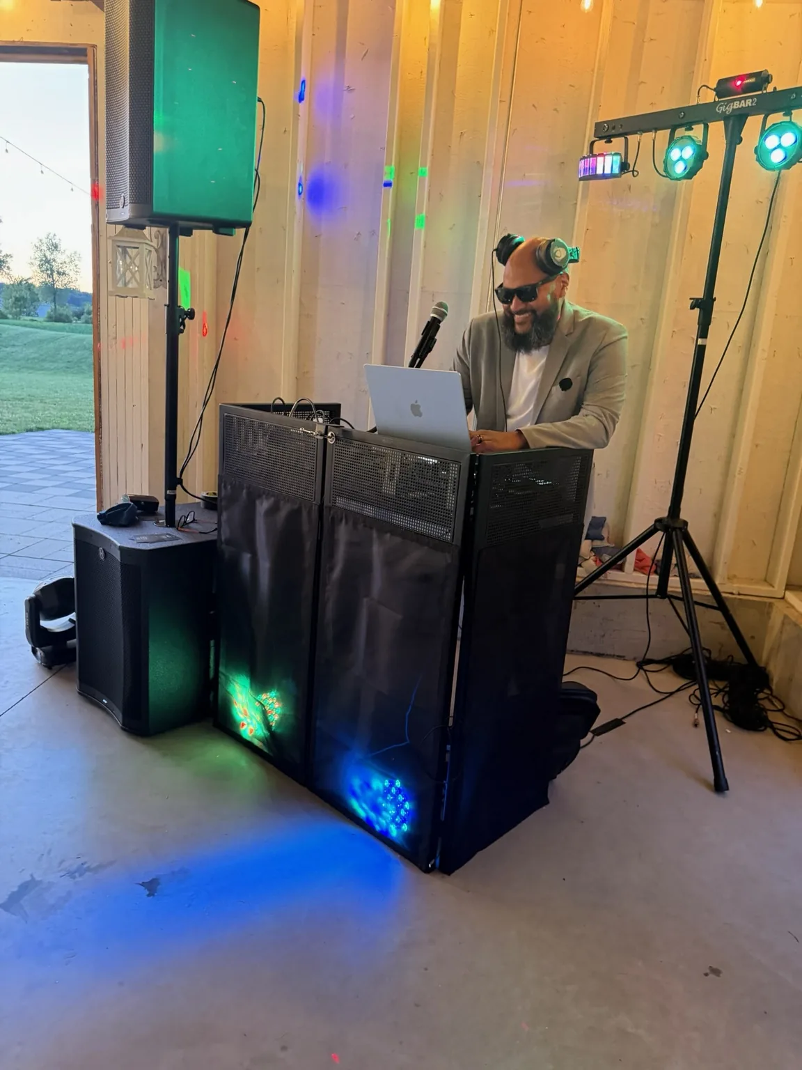 Two DJs performing together behind their sound equipment